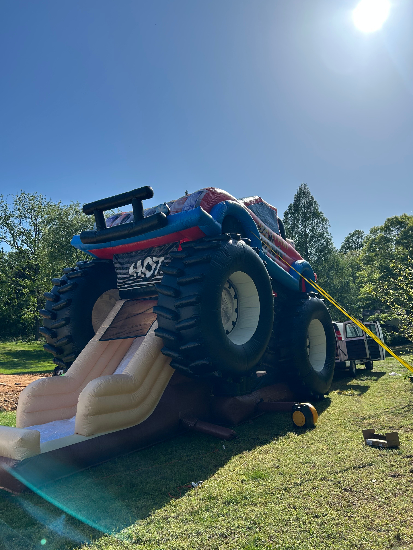 Monster truck bounce house with slide