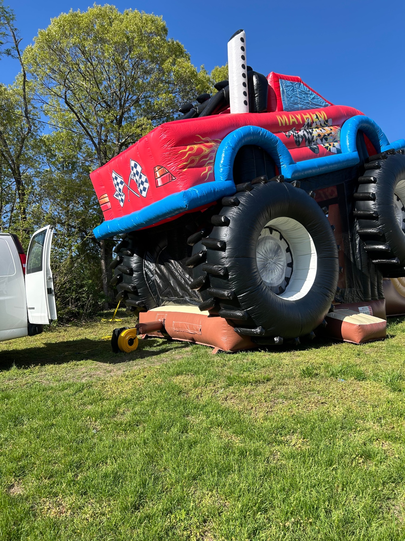 Monster truck bounce house side view